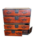 Brown Keyaki wood Isho-Dansu clothing chest with four drawers, two drawers open, side door partially open.