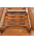 Brown wooden lounge chair with slanted back on wooden floor.