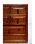 Wooden jewelry box with five drawers and metal keyhole plates, displayed on a white background.