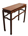 Black lacquered wood Asian altar table with narrow rectangular top, four straight legs, and vintage detailing.