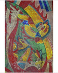 Yellow Laotian parchment painting with two dragons, red and blue details, clouds, and a raised arm, close-up view.