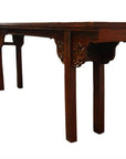 Brown antique elm wood altar table with ornate carvings and straight legs, displayed on a plain white background.