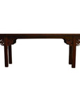Dark wood altar table with ornate carved corners, straight legs, and stained finish, front view.
