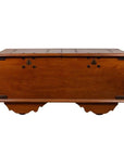 Brown teak wood blanket chest with iron nailheads and wheels, antique style, on a plain white background.