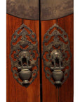 Dark wood large armoire with ornate round medallion hardware, 19th-century Chinese style accents on doors.