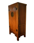 Brown wood armoire with carved panel doors, ornate metal handles, and decorative carved legs, front view.