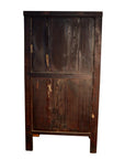 Weathered wood armoire with carved panels, scratches, and dark stains against a white background.