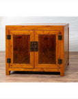 Two-toned burl and elm wood Chinese cabinet with doors, antique finish, photographed indoors.