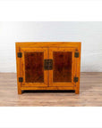 Brown burl and elm wood two-toned cabinet with doors on a hardwood floor indoors.