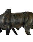 Brown leather gnu sculpture with visible ribs in a hunched walking pose, handmade, shown in good condition.