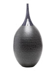 Black handmade ceramic Thai vase with narrow neck and horizontal white lines, close-up, crafted in Northern Thailand.