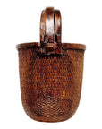 Natural woven basket with sturdy handle, large size, for magazines, on plain white background.