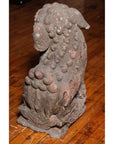 Stone lions, grey stone, textured coats, 16th-17th century China, Ming Dynasty style, set of two on display.