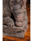 Close-up of gray stone lion paw sculpture on carved base, Late Ming Dynasty, 16th-17th century China.