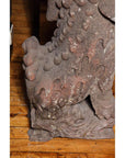 Close-up of gray stone lion paw and claws, antique, Late Ming Dynasty, on wood surface, China, 16th-17th century.