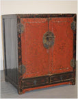 Black and red wood cabinet with ornate metal hardware, two bottom drawers, antique Chinese style, front view.