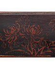 Dark wood mirror stand with black lacquer finish, etched chrysanthemum motif, and reddish-brown accents.