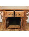 Natural elmwood altar cabinet with carved spandrels, two open drawers, and two lower doors on a wooden floor.