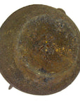 Brown ceramic teapot with a round shape, rough textured surface, and visible discoloration patches, on neutral background.