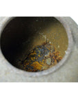 Close-up of brown metal Japanese teapot interior with rust and mineral deposits, used condition.