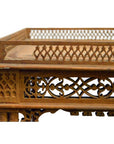 Brown wooden hand carved table with ornate lattice designs and a raised decorative border, vintage style.