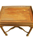 Brown wood hand-carved table with ornate carved designs, lattice sides, and detailed legs, top view.