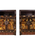 Dark wood Chinese display cabinets with carved panels and hand-painted Chinoiserie motifs, pair, front view.