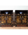 Black lacquer wood Chinese display cabinets with hand painted chinoiserie motifs, blue and white bowls on top shelves.