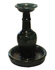 Dark green glazed ceramic antique Chinese Hunan candle holders with narrow necks and wide bases, on white background.