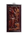 Dark wood Chinese carvings, two intricately carved robed figures framed, displayed on white background, close-up.