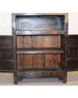 Wood display cabinets with two open lower doors and shelves, empty compartments visible, indoors.