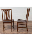 Brown wooden Indonesian side chairs with pierced splats, mid-century style, shown on a wooden floor indoors.