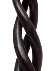 Brown wooden Indian candlesticks with spiral design, vintage style, close-up on white background.