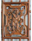 Brown wooden 2-panel screen with open fretwork, person in traditional attire, and decorative patterns.