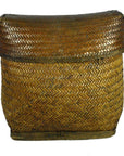 Brown rattan rectangular basket with fitted lid, tight herringbone weave, close-up view.