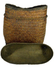 Natural rattan baskets set, one tall with rounded top and one shallow oval, close-up view.