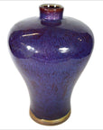 Close-up of deep blue glazed ceramic vase with glossy finish, narrow neck, wide body; very good condition.