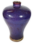 Close-up of deep blue glazed ceramic vase with glossy finish, narrow neck, wide body; very good condition.