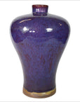 Close-up of glossy purple ceramic vase with narrow neck and rounded shoulders in very good condition.