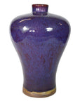 Close-up of glossy purple ceramic vase with narrow neck and rounded shoulders in very good condition.