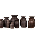 Brown wooden ghee pots, primitive and rustic, set of three, five, or seven on a white background.