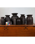 Brown wooden ghee pots displayed on a chest with a color card in front, set of 3, 5, or 7.