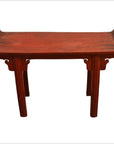 Red patina wood altar table with four straight legs and slightly raised edge, front view.