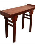 Red patina wood altar table with curved edges, decorative supports, and four straight legs.