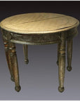 Silver nickel demi-lune table with repousse and carved details, four turned legs, against dark gradient background.