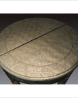 Silver nickel demi-lune table with repousse floral engravings and a visible split on the tabletop.