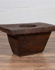 Brown wooden planter with square top, round center, and tapered base, early 20th century, rustic style.