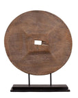 Brown wooden ox cart wheel from Thailand on black base, displayed indoors.