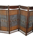 Dark brown frame four-panel room divider with woven rattan panels, indoor setting.