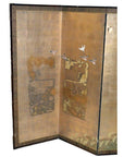 Gold Japanese folding screen with flying birds and abstract weathered patterns on a shimmering background.